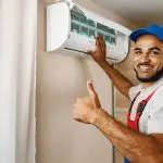 Man fixing AC